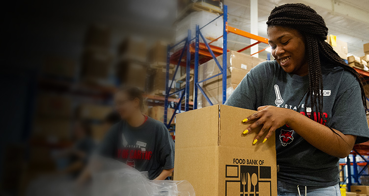 A student working at the food bank