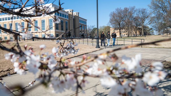 Students walk across campus at A-State