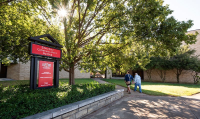 A sunny day outside of the Education and Communication building at Arkansas State University