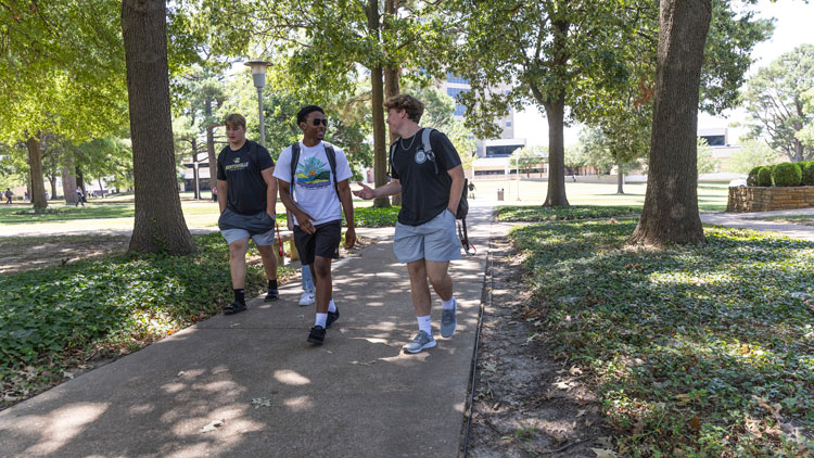 Students walk across campus at A-State