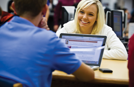 students with laptop